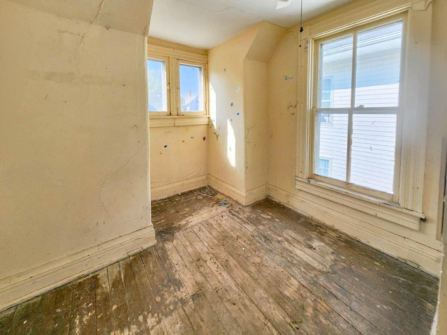 unfurnished room featuring dark hardwood / wood-style flooring