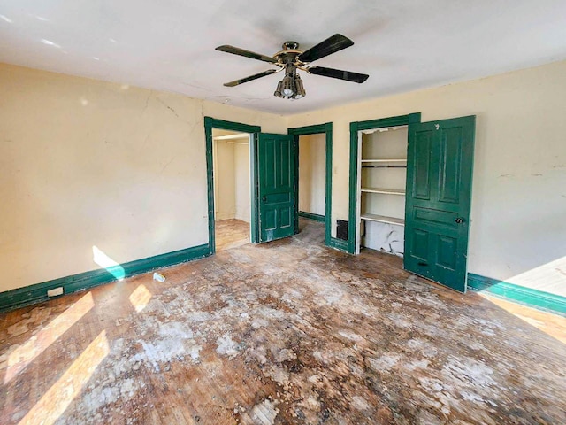 unfurnished bedroom featuring ceiling fan