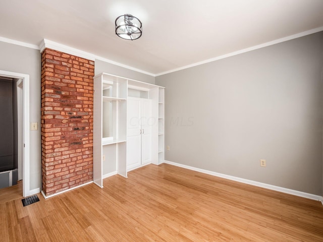 unfurnished bedroom with light hardwood / wood-style floors and ornamental molding