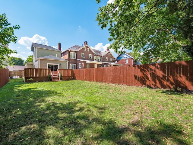 view of yard with a wooden deck