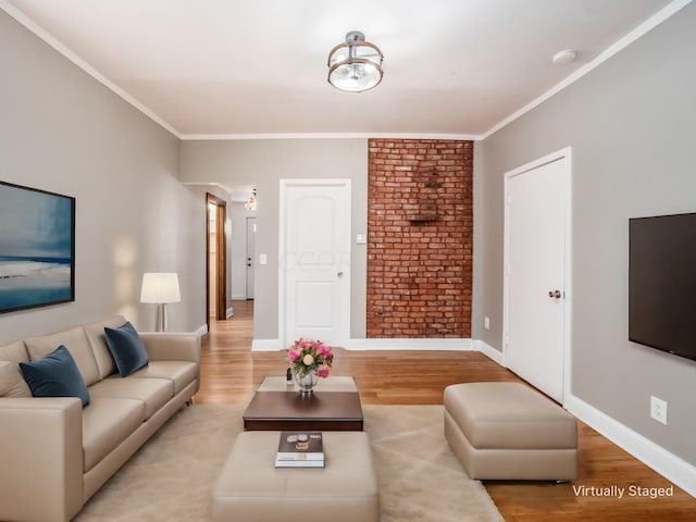 living room with crown molding and light hardwood / wood-style floors