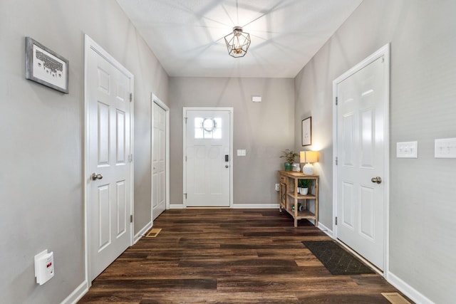 entrance foyer with dark hardwood / wood-style flooring