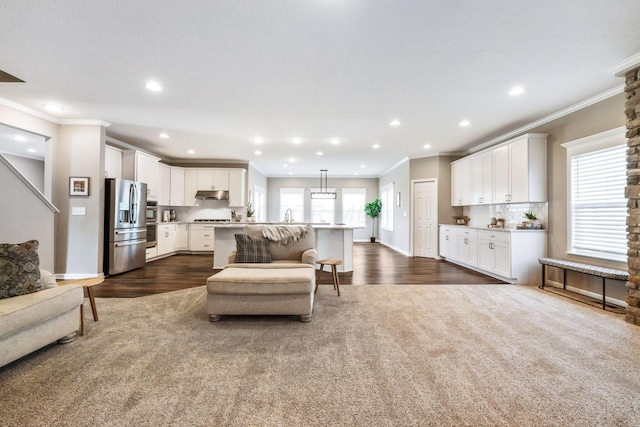 living room featuring ornamental molding and dark wood-type flooring