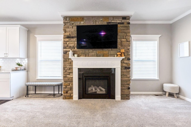 unfurnished living room with crown molding, a large fireplace, and carpet