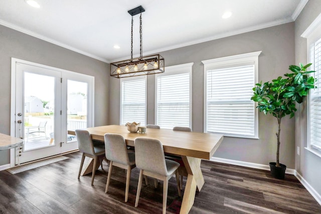 dining area featuring dark hardwood / wood-style flooring and ornamental molding