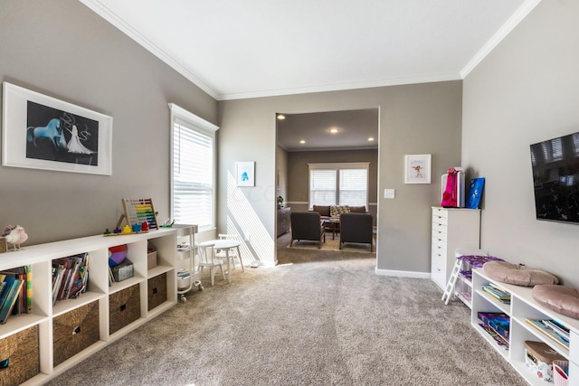 recreation room featuring crown molding and carpet