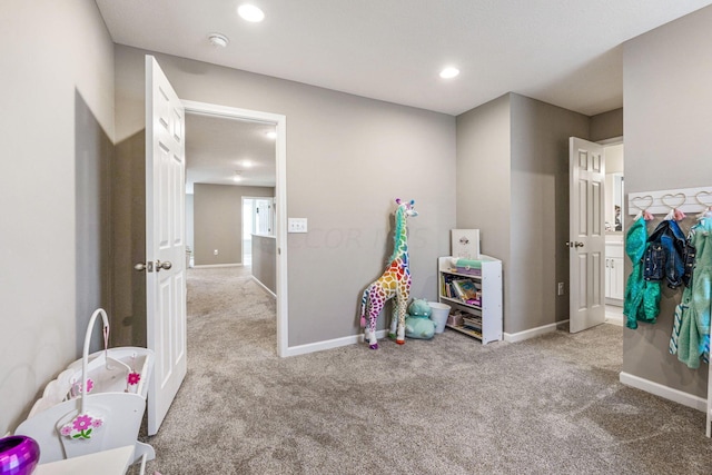 playroom featuring light colored carpet