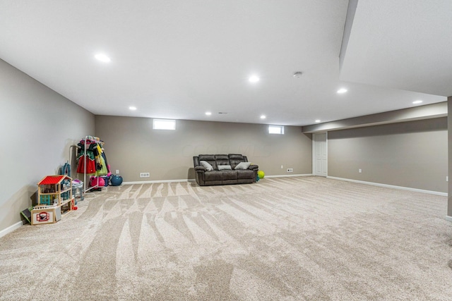 recreation room with light carpet and a wealth of natural light