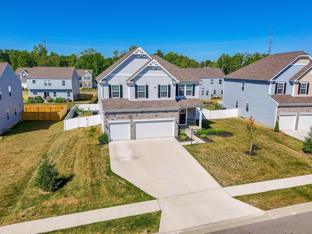 view of front of property with a garage and a front yard