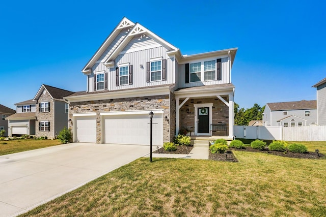 view of front of house with a garage and a front yard