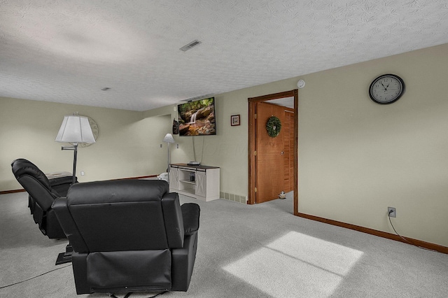 living room featuring light carpet and a textured ceiling