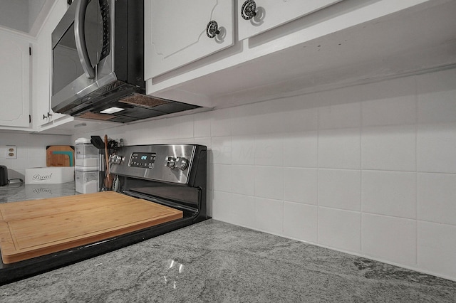 kitchen with white cabinetry and decorative backsplash