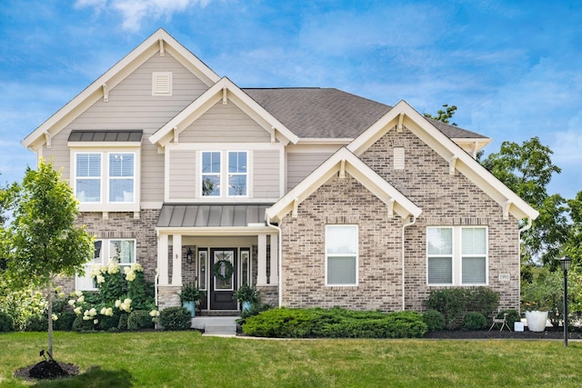 craftsman inspired home with a front yard