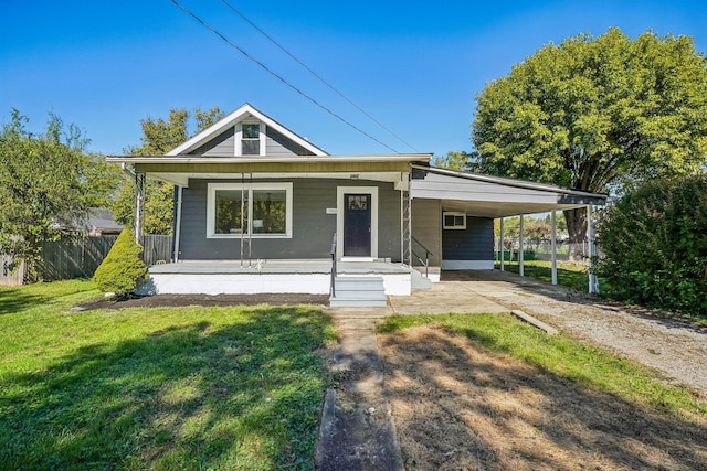 bungalow-style home with a carport, a porch, and a front lawn