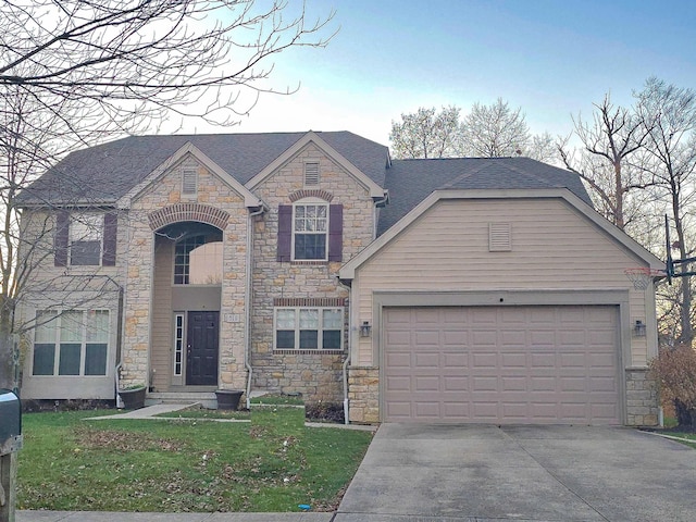 view of front of home with a front lawn and a garage