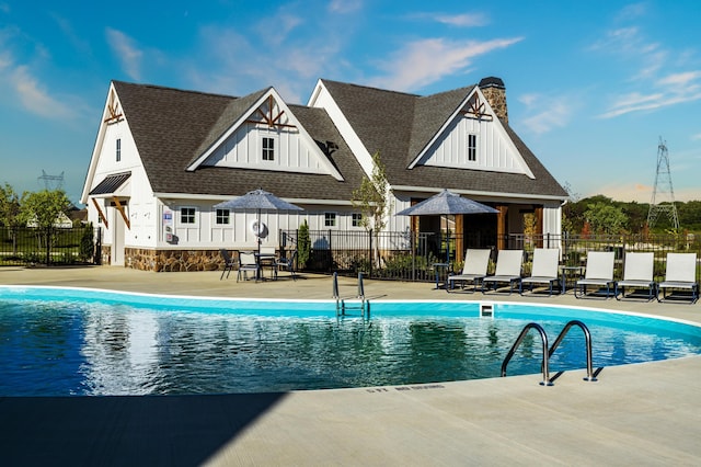 view of swimming pool featuring a patio area