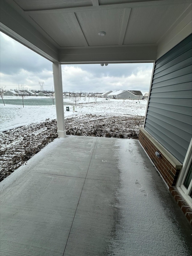 view of snow covered patio