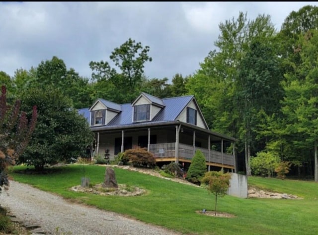 view of front of home with covered porch and a front yard