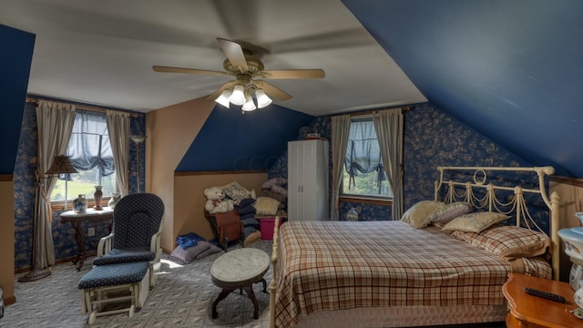 carpeted bedroom featuring ceiling fan and lofted ceiling