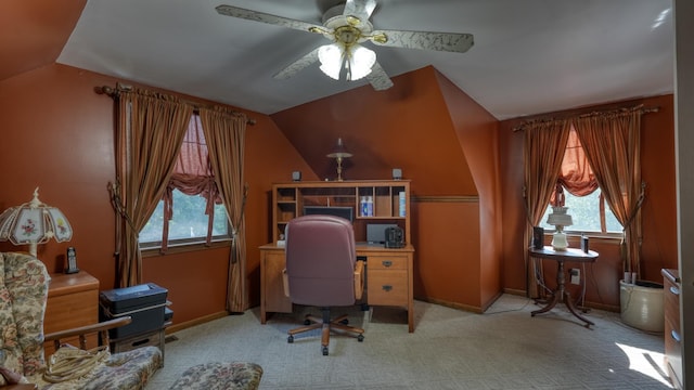 carpeted home office featuring ceiling fan and lofted ceiling