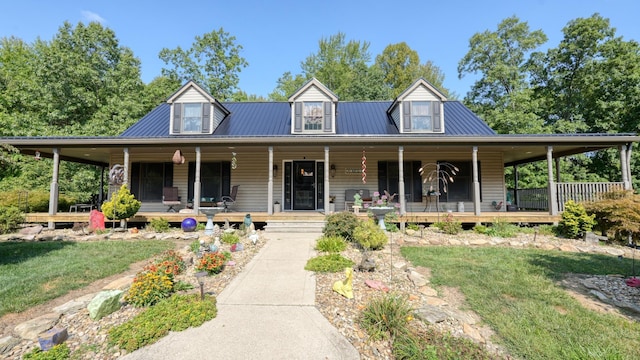 farmhouse with a porch and a front lawn