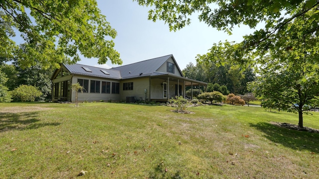 exterior space with a sunroom and cooling unit