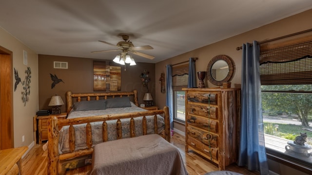 bedroom featuring ceiling fan and light hardwood / wood-style flooring