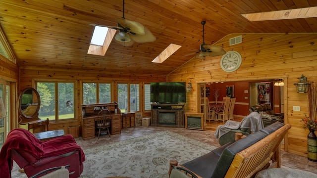 living room with high vaulted ceiling, wooden walls, a skylight, ceiling fan, and wood ceiling