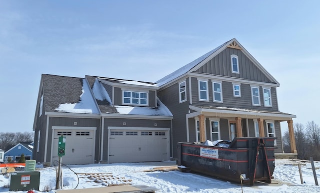 view of front facade featuring an attached garage, covered porch, and board and batten siding