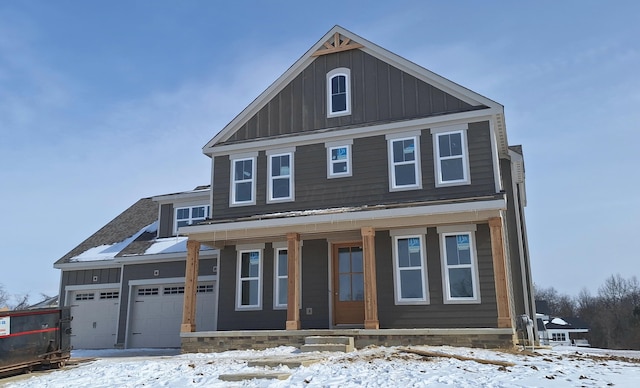 view of front of property with an attached garage, a porch, and board and batten siding