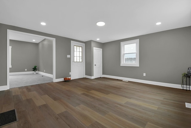 entrance foyer with recessed lighting, visible vents, baseboards, and wood finished floors