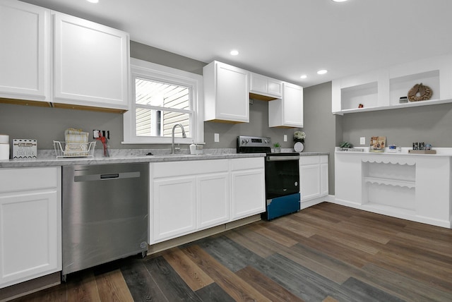 kitchen featuring open shelves, stainless steel appliances, white cabinetry, and a sink