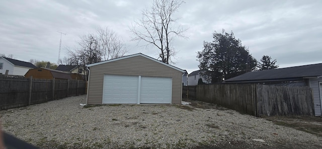 379 Thompson St, Marion, OH 43302 - garage featuring driveway and fence