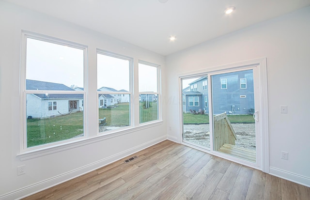 interior space with a healthy amount of sunlight and light hardwood / wood-style floors