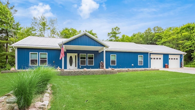 view of front of house featuring a garage and a front yard