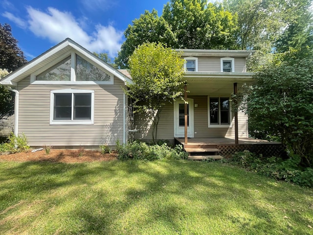 view of front of house with a porch and a front yard