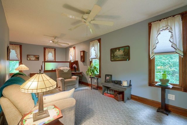 carpeted living room featuring ceiling fan