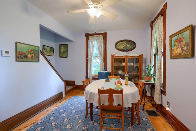 dining area featuring ceiling fan and hardwood / wood-style flooring