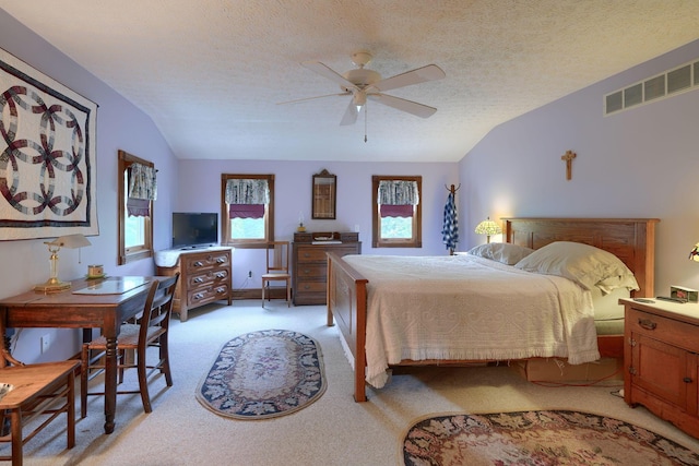 carpeted bedroom featuring a textured ceiling, ceiling fan, and lofted ceiling