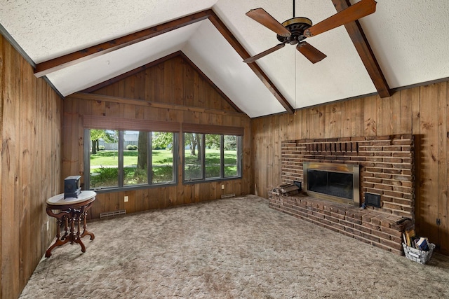 1980 Walker Lake Rd, Ontario, OH 44906 - living room with a fireplace, ceiling fan, wooden walls, and lofted ceiling with beams