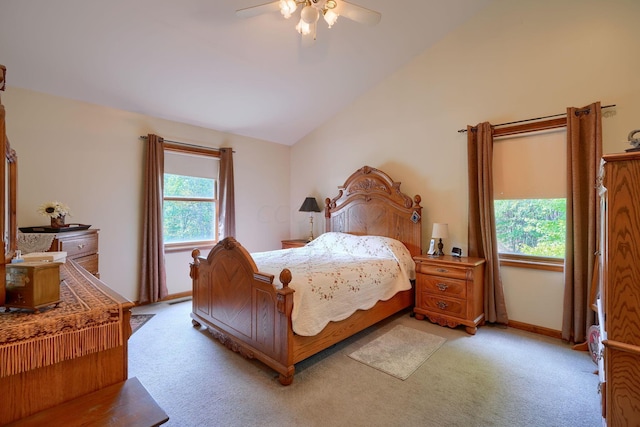 bedroom featuring ceiling fan, light colored carpet, and lofted ceiling