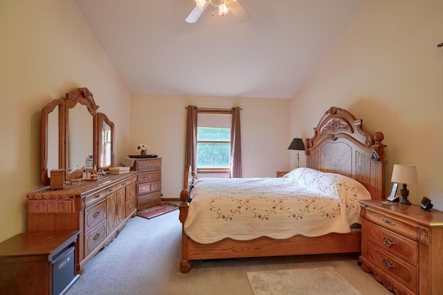 carpeted bedroom featuring ceiling fan and lofted ceiling