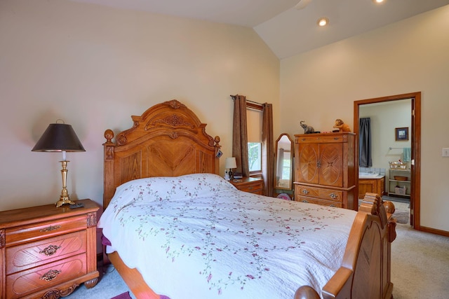 bedroom featuring lofted ceiling and light carpet