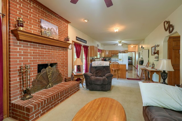 carpeted living room with a brick fireplace