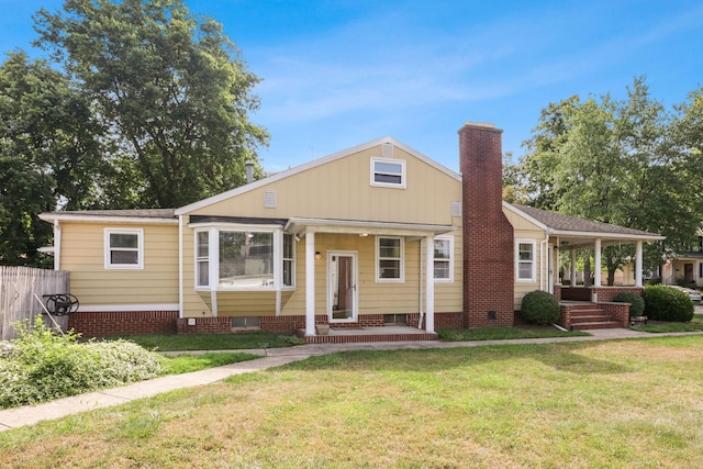 view of front of home with a front yard