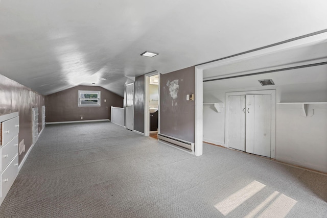 bonus room with carpet floors, baseboard heating, and vaulted ceiling