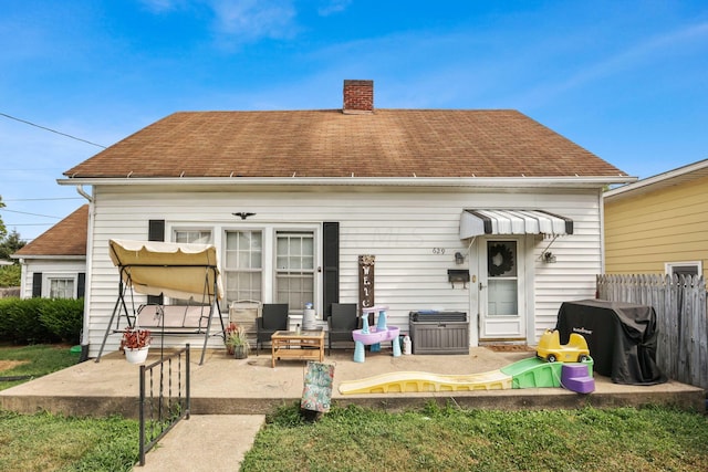 back of property featuring a patio area