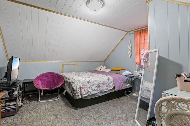 carpeted bedroom with lofted ceiling