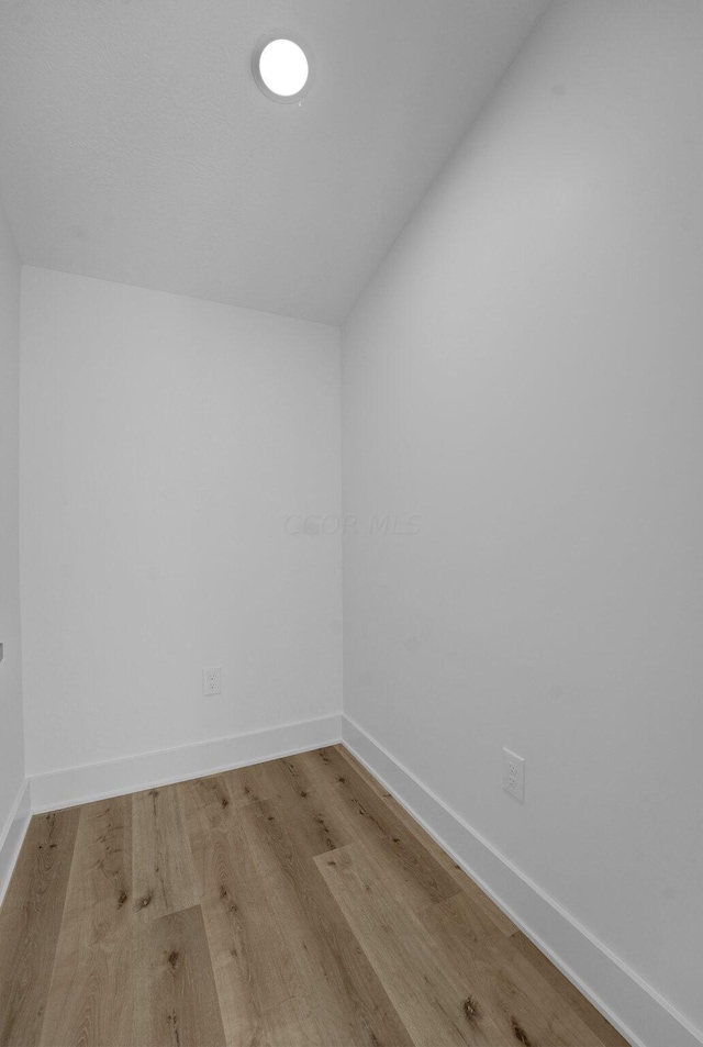 spare room featuring light hardwood / wood-style floors