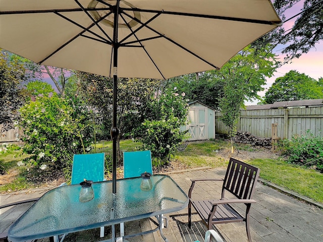 patio terrace at dusk with a shed